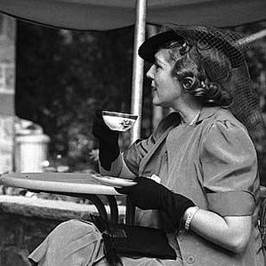 Mary Pickford speaking and holding a tea cup